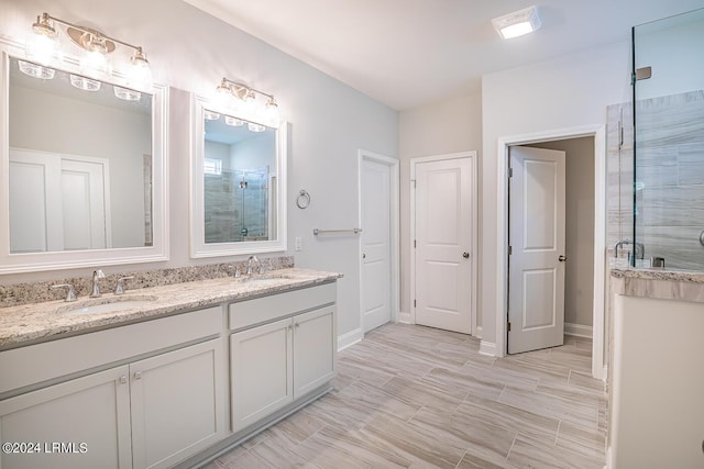 bathroom with an enclosed shower and vanity