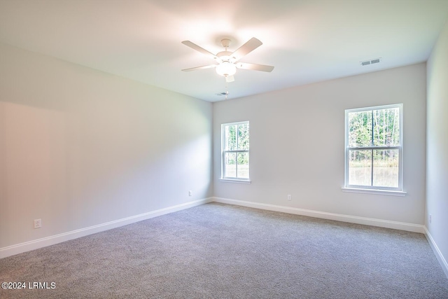 spare room with ceiling fan and carpet floors