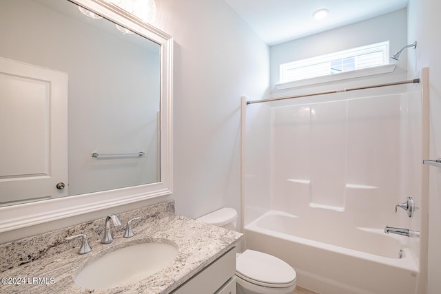 full bathroom featuring vanity, tub / shower combination, and toilet