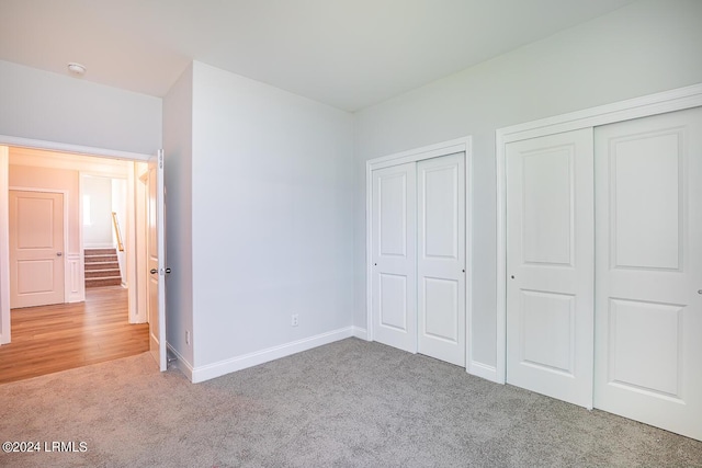 unfurnished bedroom with light carpet