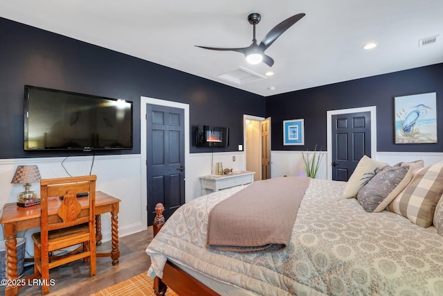 bedroom with ceiling fan and hardwood / wood-style floors