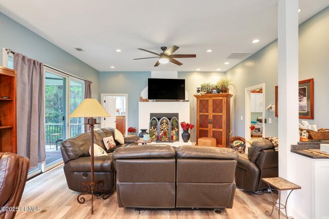 dining room with french doors, vaulted ceiling, ceiling fan, brick wall, and hardwood / wood-style floors