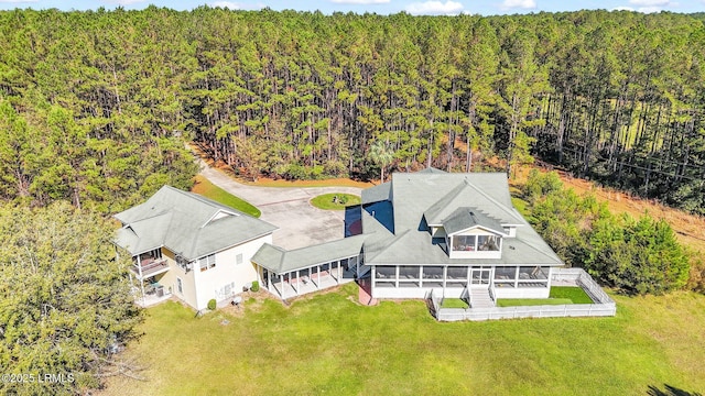 drone / aerial view with a view of trees