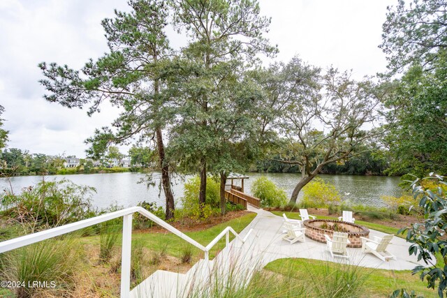 property view of water featuring an outdoor fire pit