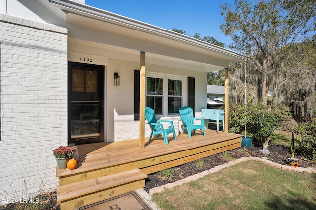 wooden terrace with a porch