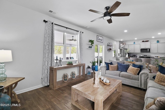 living room featuring baseboards, recessed lighting, visible vents, dark wood finished floors, and ceiling fan