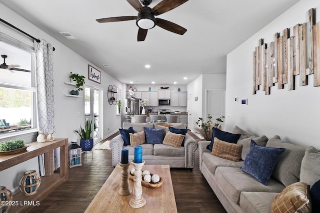 living area featuring dark wood-style flooring, visible vents, ceiling fan, and recessed lighting