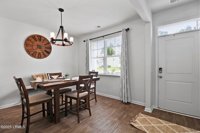 dining room with visible vents, baseboards, an inviting chandelier, and dark wood finished floors