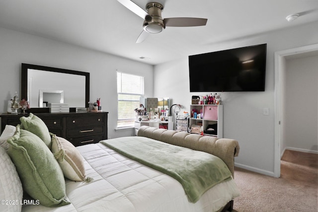bedroom featuring carpet floors, baseboards, a ceiling fan, and visible vents