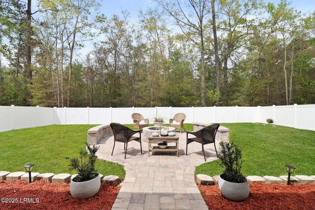 view of patio featuring a fire pit and a fenced backyard