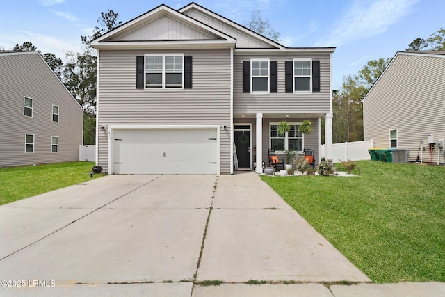 view of front of property with a front yard, an attached garage, covered porch, fence, and driveway