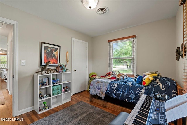 bedroom with wood finished floors