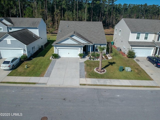 view of front facade with a garage and a front lawn