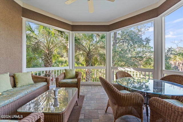 sunroom / solarium with ceiling fan