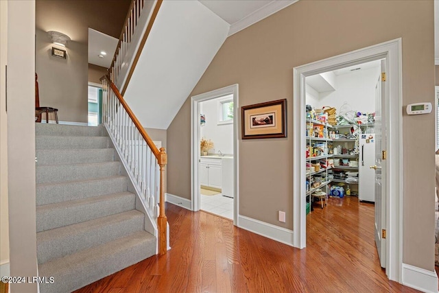 stairs with hardwood / wood-style floors