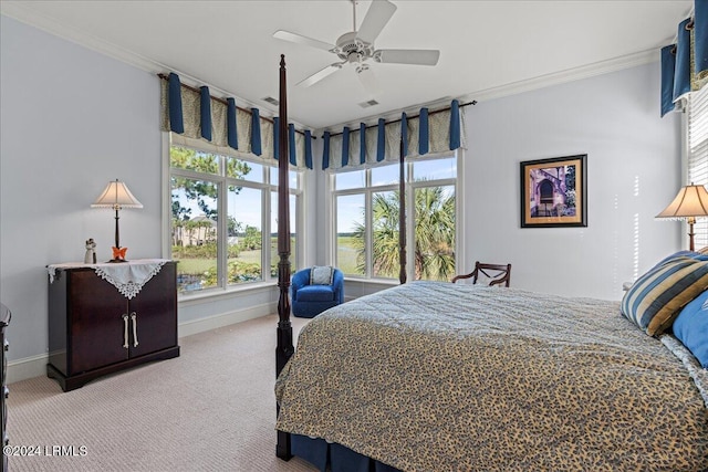 carpeted bedroom featuring ceiling fan and ornamental molding