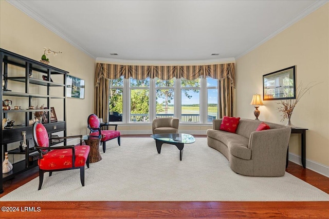 living room with wood-type flooring and ornamental molding