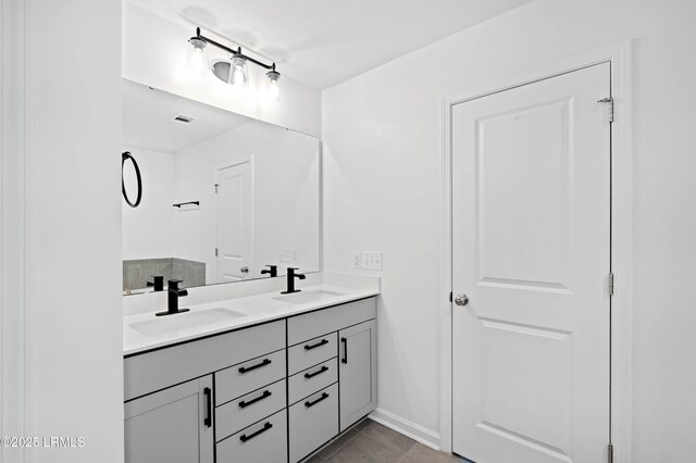 68 Keowee Ln, Beaufort, SC 29906 - bathroom featuring tile patterned floors, double vanity, a sink, and baseboards