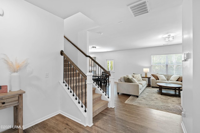 68 Keowee Ln, Beaufort, SC 29906 - stairs featuring visible vents, baseboards, and wood finished floors