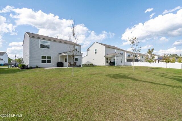 68 Keowee Ln, Beaufort, SC 29906 - back of property featuring a patio area, fence, and a lawn