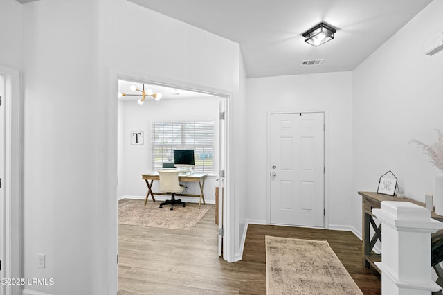 68 Keowee Ln, Beaufort, SC 29906 - entryway with a chandelier, visible vents, baseboards, and wood finished floors