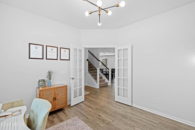 68 Keowee Ln, Beaufort, SC 29906 - sitting room featuring a chandelier, french doors, wood finished floors, and baseboards