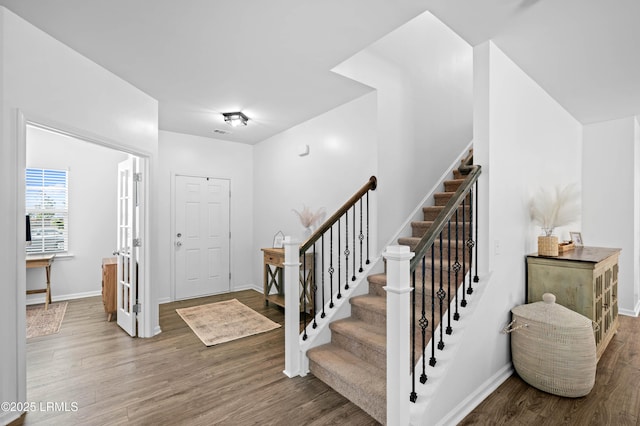 68 Keowee Ln, Beaufort, SC 29906 - entrance foyer with visible vents, baseboards, stairway, and wood finished floors