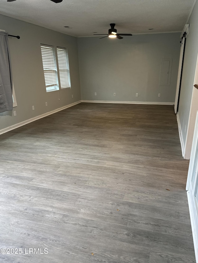 208 Squirrel Aly, Ridgeland, SC 29936 - empty room with a barn door, a ceiling fan, wood finished floors, a textured ceiling, and baseboards