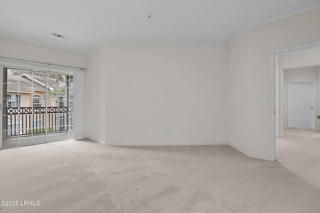 empty room featuring light colored carpet, visible vents, and baseboards