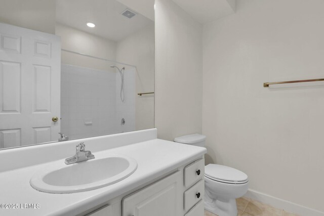 bathroom featuring a shower, visible vents, toilet, vanity, and tile patterned flooring