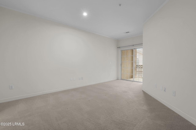 carpeted spare room featuring visible vents, baseboards, and recessed lighting