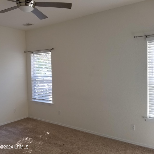 unfurnished room featuring carpet floors and ceiling fan