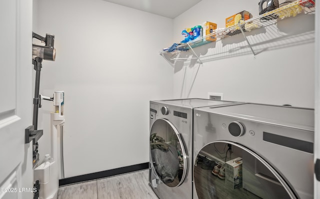128 Teal Bluff Blvd, Seabrook, SC 29940 - washroom featuring separate washer and dryer and light wood-style flooring