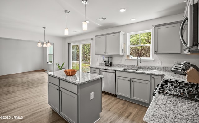 128 Teal Bluff Blvd, Seabrook, SC 29940 - kitchen featuring appliances with stainless steel finishes, gray cabinetry, a kitchen island, and recessed lighting