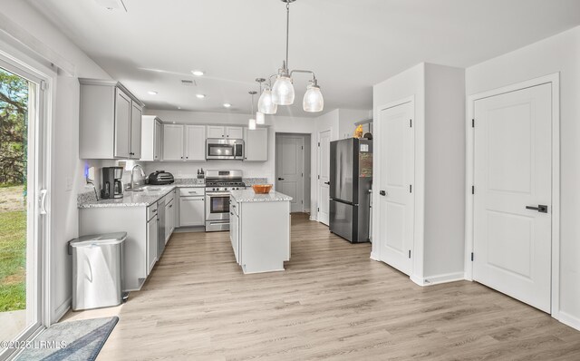 128 Teal Bluff Blvd, Seabrook, SC 29940 - kitchen featuring appliances with stainless steel finishes, gray cabinets, a center island, recessed lighting, and light wood finished floors