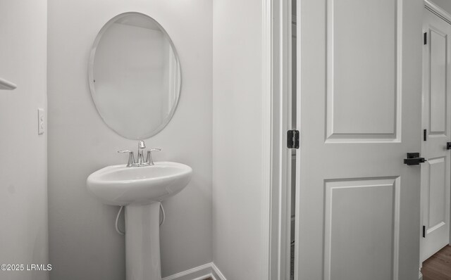 128 Teal Bluff Blvd, Seabrook, SC 29940 - bathroom featuring baseboards and wood finished floors