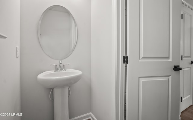 128 Teal Bluff Blvd, Seabrook, SC 29940 - bathroom featuring baseboards and wood finished floors
