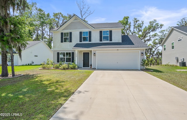 128 Teal Bluff Blvd, Seabrook, SC 29940 - traditional-style house with concrete driveway and a front lawn