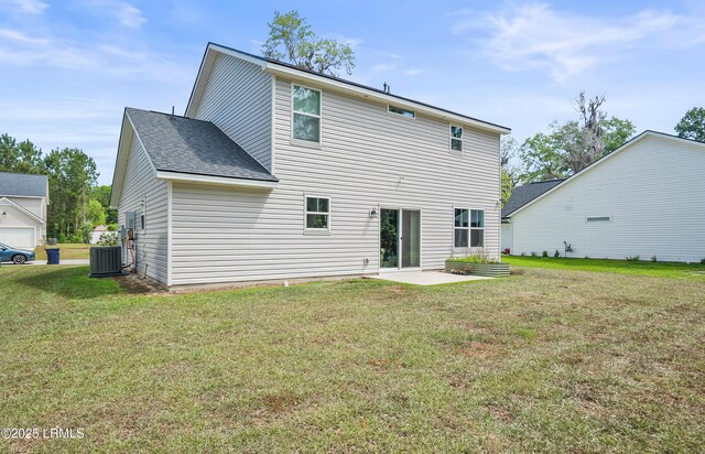 128 Teal Bluff Blvd, Seabrook, SC 29940 - back of house with a patio, a lawn, and roof with shingles
