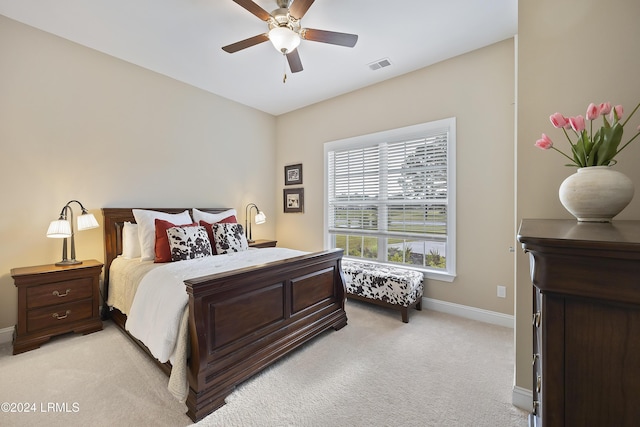 bedroom featuring ceiling fan and light colored carpet