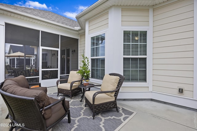 view of patio with a sunroom