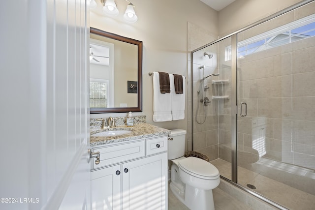 bathroom with plenty of natural light and a shower with shower door