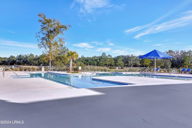 view of swimming pool featuring a patio area