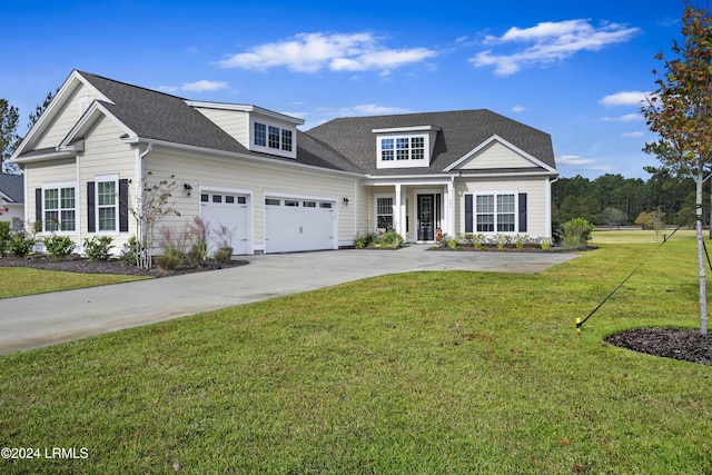 view of front of home featuring a garage and a front yard