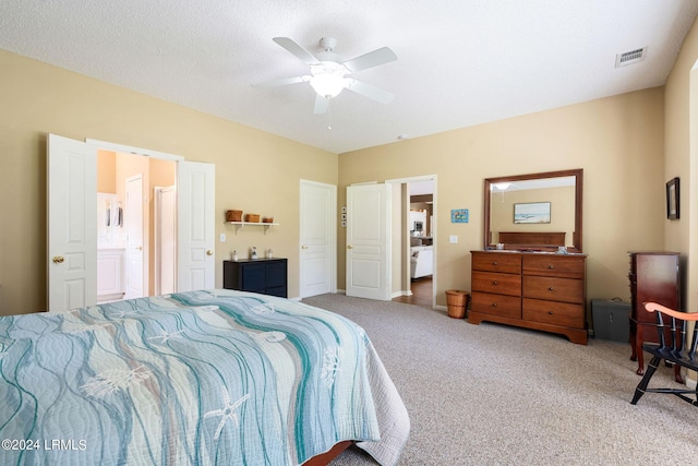 carpeted bedroom featuring connected bathroom, a textured ceiling, and ceiling fan