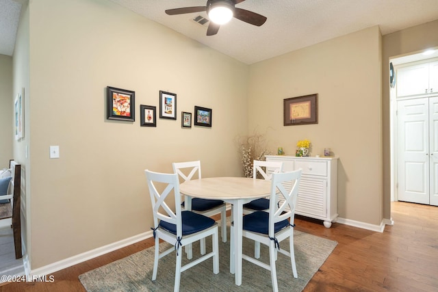 dining room featuring hardwood / wood-style flooring and ceiling fan