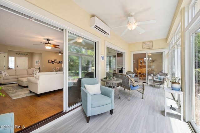 sunroom / solarium with a wealth of natural light, a wall mounted AC, and ceiling fan