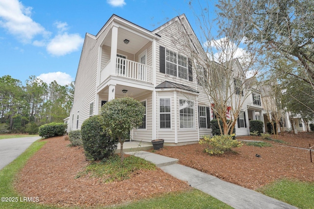 multi unit property featuring a balcony