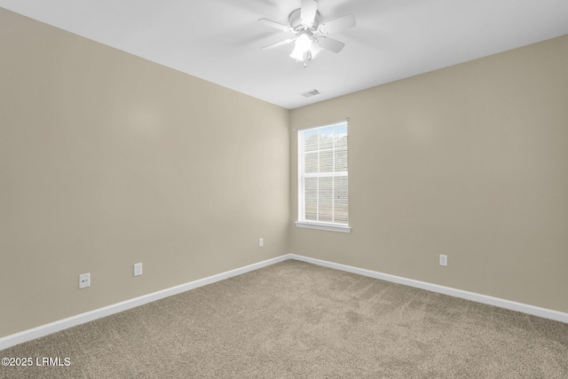 unfurnished room featuring ceiling fan and carpet flooring