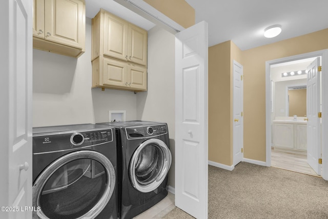 washroom with separate washer and dryer, sink, and light colored carpet